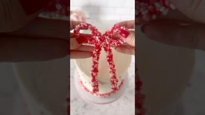 Easy Valentines Day cake idea Nerds Rope Candy Bow  tutorial on Bakingwithblondie.com