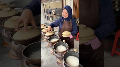 Traditional Claypot Chicken Rice Cooked With Charcoal in Kuala Lumpur